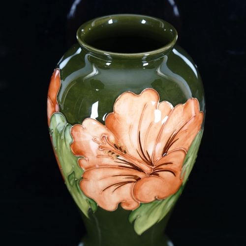 1430 - MOORCROFT POTTERY - a coral Hibiscus pattern vase, height 26cm