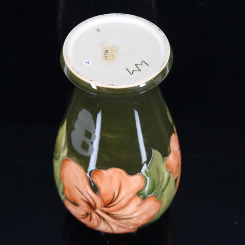 1430 - MOORCROFT POTTERY - a coral Hibiscus pattern vase, height 26cm