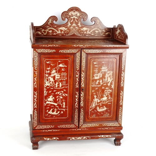 1442 - A Chinese rosewood and ivory marquetry inlaid table cabinet of small size, circa 1990, 2 panelled do... 