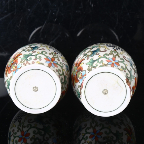 1446 - A pair of Chinese white ground cloisonne enamel vases, detailed multi-colour decoration, height 22cm... 