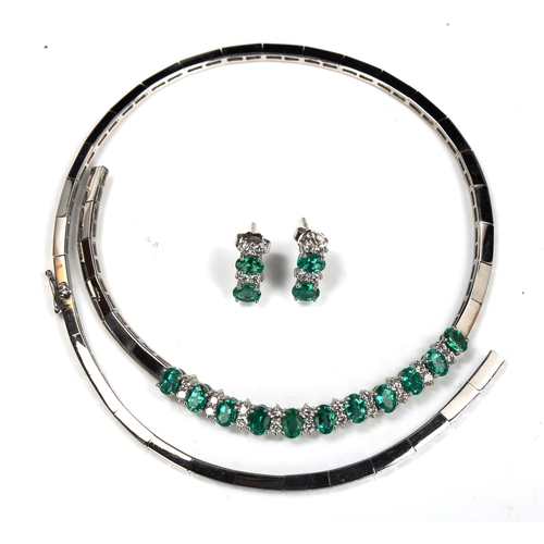 725 - A modern 18ct white gold emerald and diamond matching necklace and earring set, set with oval mixed-... 