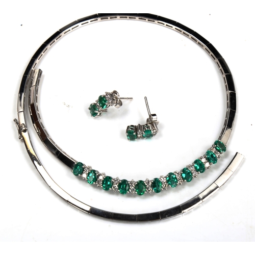 725 - A modern 18ct white gold emerald and diamond matching necklace and earring set, set with oval mixed-... 