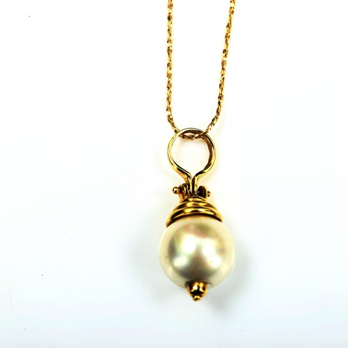 732 - A modern cultured pearl pendant necklace, with unmarked 14ct gold mount and 18ct chain, pendant heig... 