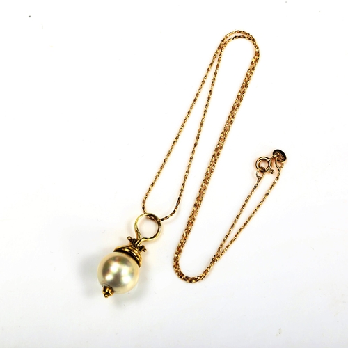 732 - A modern cultured pearl pendant necklace, with unmarked 14ct gold mount and 18ct chain, pendant heig... 