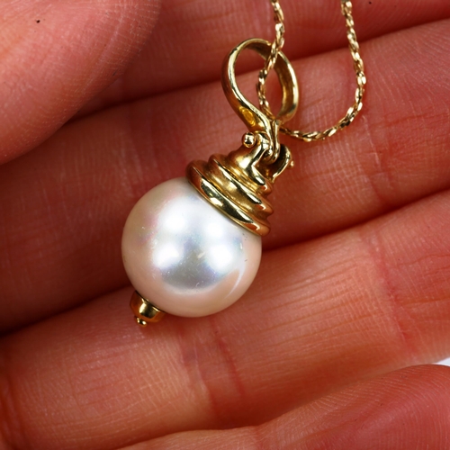 732 - A modern cultured pearl pendant necklace, with unmarked 14ct gold mount and 18ct chain, pendant heig... 