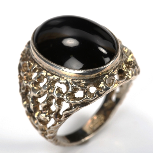 740 - A large 1970s silver onyx ring, pierced and textured organic form shoulders, hallmarks Birmingham 19... 