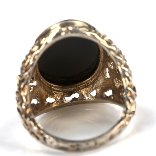 740 - A large 1970s silver onyx ring, pierced and textured organic form shoulders, hallmarks Birmingham 19... 