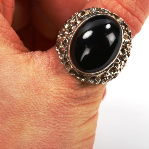 740 - A large 1970s silver onyx ring, pierced and textured organic form shoulders, hallmarks Birmingham 19... 