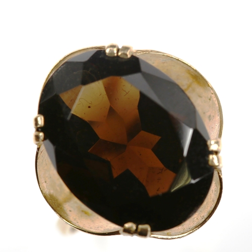 741 - A Continental unmarked gold smoky quartz dress ring, setting height 17.8mm, size M, 3.6g