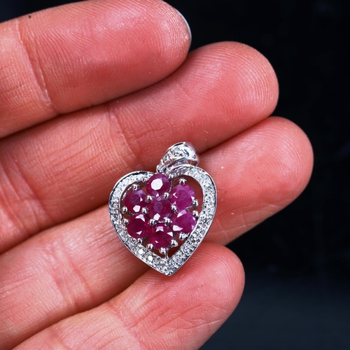 744 - A modern 9ct white gold ruby and diamond cluster heart pendant, pendant height 23.1mm, 2.5g