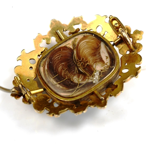 747 - A Victorian unmarked gold pearl enamel and diamond memorial brooch, with floral motif and hair panel... 