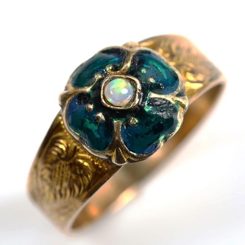 748 - An Antique opal and enamel clover ring, unmarked gold settings with floral engraved shoulders, setti... 