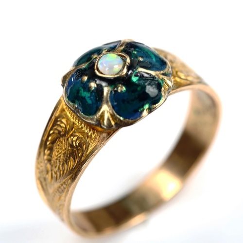 748 - An Antique opal and enamel clover ring, unmarked gold settings with floral engraved shoulders, setti... 