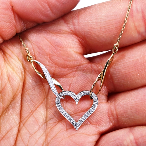 749 - A modern 9ct gold diamond heart necklace, length 42cm, 2.6g