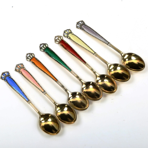 751 - A set of 7 Norwegian vermeil sterling silver and harlequin enamel coffee spoons, length 10cm