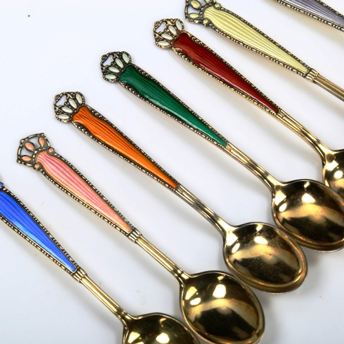 751 - A set of 7 Norwegian vermeil sterling silver and harlequin enamel coffee spoons, length 10cm