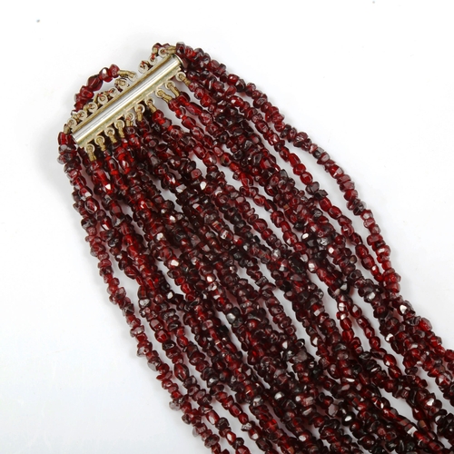 754 - A 10-strand garnet bead necklace, length 44cm, 120g