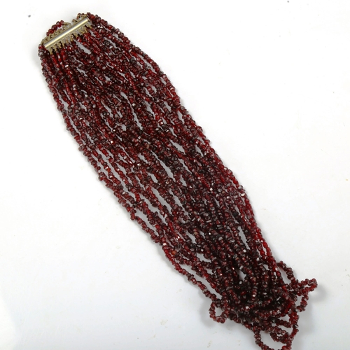 754 - A 10-strand garnet bead necklace, length 44cm, 120g