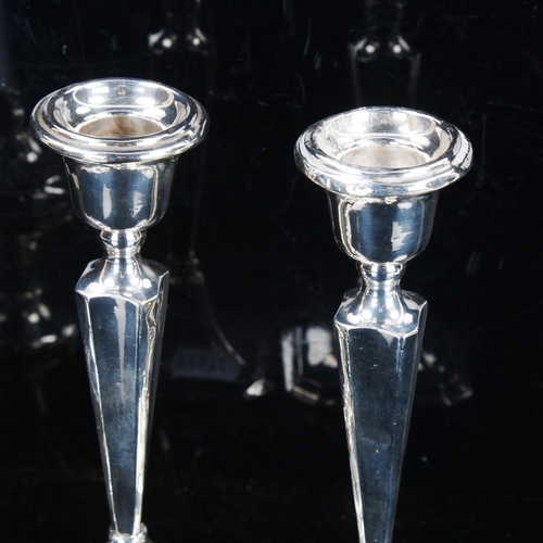 781 - A pair of silver table candlesticks, and silver dressing table atomiser, candlestick height 18cm (2)