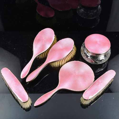 793 - A George V Art Deco silver and pink enamel 6-piece dressing table set, comprising hand mirror, 2 x h... 