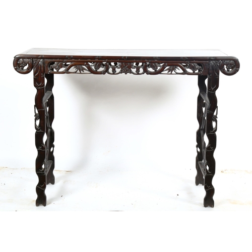 1151 - A Chinese 19th century rosewood altar table, with grapevine carved and pierced frieze on carved supp... 