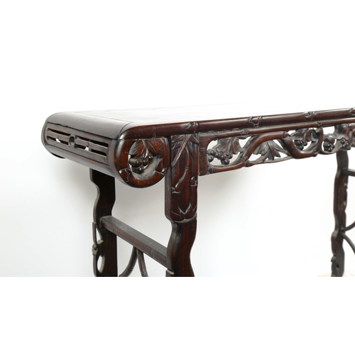 1151 - A Chinese 19th century rosewood altar table, with grapevine carved and pierced frieze on carved supp... 