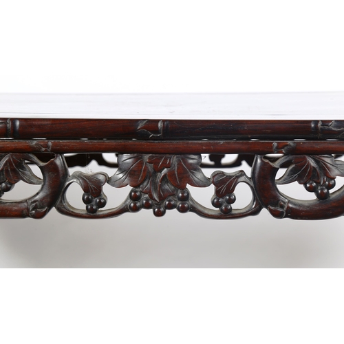 1151 - A Chinese 19th century rosewood altar table, with grapevine carved and pierced frieze on carved supp... 