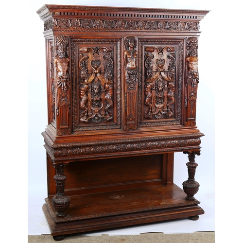 1240 - An impressive 19th century Neo-Classical design walnut 2-door cupboard, the 2 finely carved and pane... 