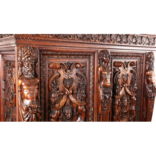 1240 - An impressive 19th century Neo-Classical design walnut 2-door cupboard, the 2 finely carved and pane... 