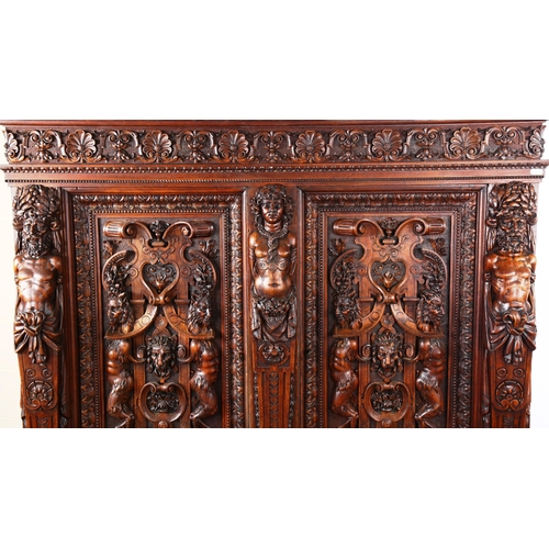 1240 - An impressive 19th century Neo-Classical design walnut 2-door cupboard, the 2 finely carved and pane... 