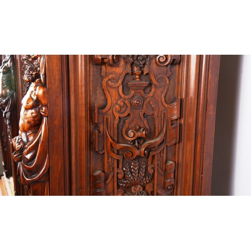 1240 - An impressive 19th century Neo-Classical design walnut 2-door cupboard, the 2 finely carved and pane... 