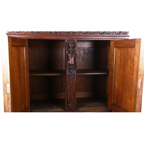 1240 - An impressive 19th century Neo-Classical design walnut 2-door cupboard, the 2 finely carved and pane... 