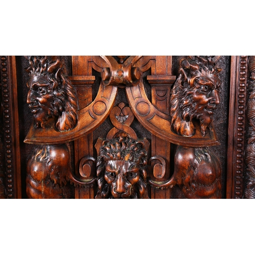 1240 - An impressive 19th century Neo-Classical design walnut 2-door cupboard, the 2 finely carved and pane... 