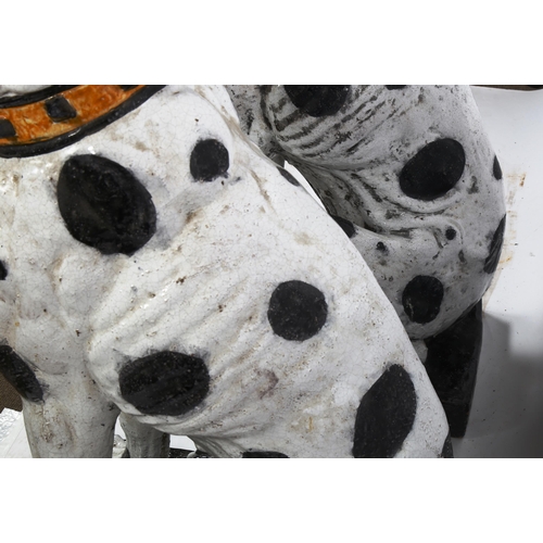 1241 - An impressive pair of life-size glazed pottery seated Dalmatian hounds with studded collars, probabl... 