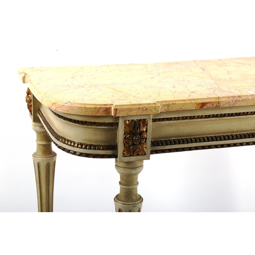 1243 - A French marble-topped console table, early 20th century, with shaped marble top on carved painted a... 