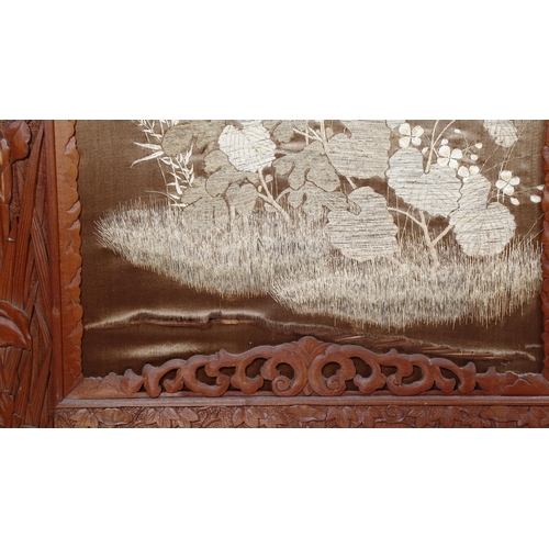 1246 - A large Chinese 3-section screen in relief carved stained wood frame, with silk embroidered panels, ... 