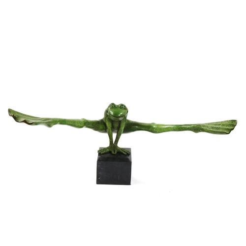 1249 - A green patinated bronze leap-frogging frog, on black marble block plinth, overall width 111cm, mode... 