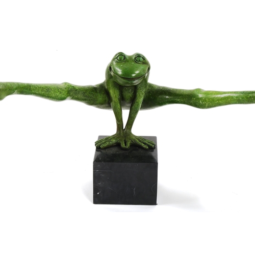 1249 - A green patinated bronze leap-frogging frog, on black marble block plinth, overall width 111cm, mode... 