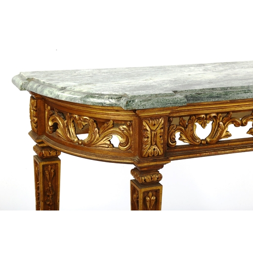 1252 - An ornate carved giltwood console table, probably mid-20th century, with green marble top and carved... 