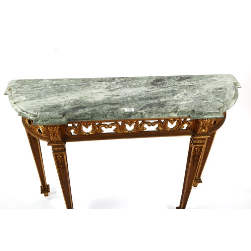 1252 - An ornate carved giltwood console table, probably mid-20th century, with green marble top and carved... 