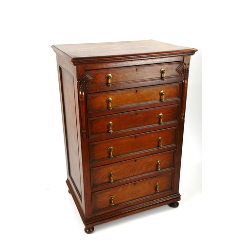 1397 - A narrow oak chest of 6 drawers, circa 1900, with panelled sides and moulded drawer fronts, width 69... 