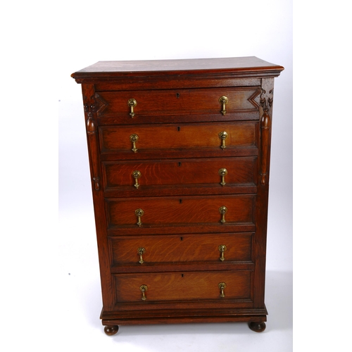 1397 - A narrow oak chest of 6 drawers, circa 1900, with panelled sides and moulded drawer fronts, width 69... 