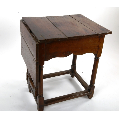 1415 - An unusual 18th century joined oak single drop leaf occasional table of small size, with single frie... 