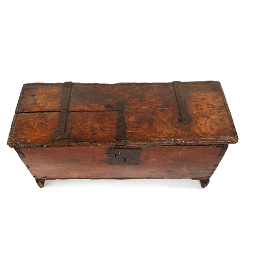 1416 - A 17th/18th century oak coffer of plank construction, with iron hinges, length 95cm