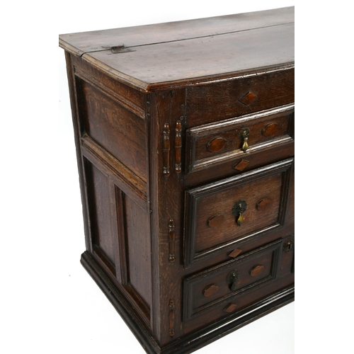 1418 - A 17th/18th century joined oak chest of drawers, with rising top, 2 short and 2 long drawers below w... 