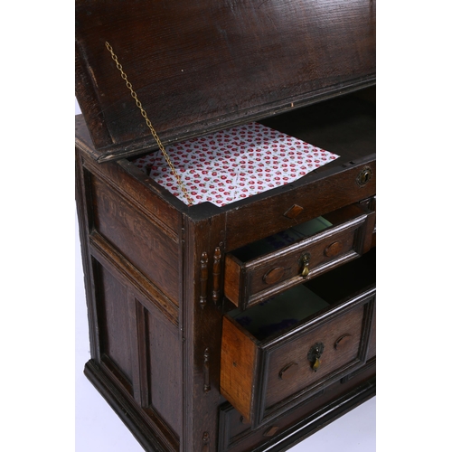 1418 - A 17th/18th century joined oak chest of drawers, with rising top, 2 short and 2 long drawers below w... 