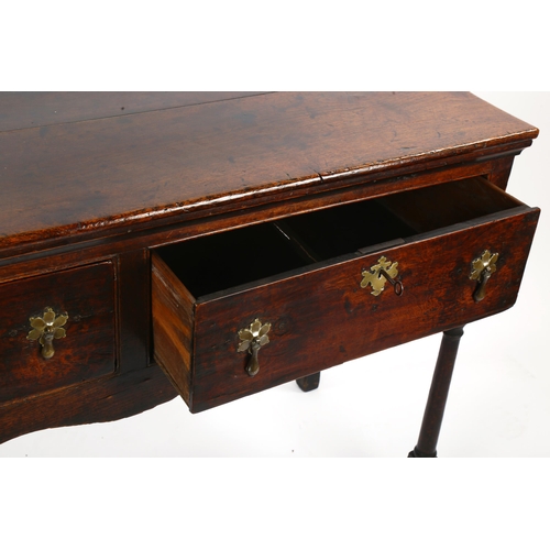 1419 - An 18th century oak 2-drawer dresser base of small size, with turned legs, length 127cm, depth 44cm,... 