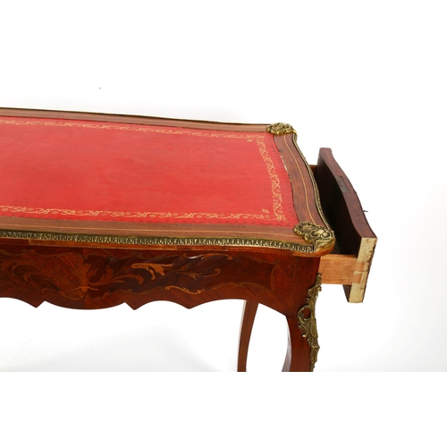 1422 - A French marquetry inlaid kingwood writing table, circa 1900, with serpentine-shaped surround, inset... 