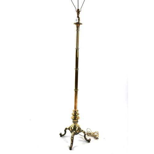 1424 - A good quality Victorian brass standard lamp, on heavy quadruple base, converted to electric