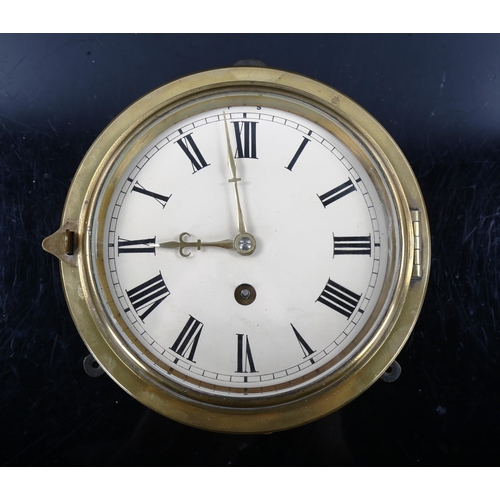 79Q - A 19th century brass-fronted circular dial bulkhead 30-hour wall clock, cream enamel dial with Roman... 